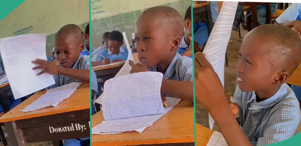 Boy struggles to read in an examination hall.