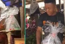 Wife visits husband who sells meat in the market, gives him cake on his birthday