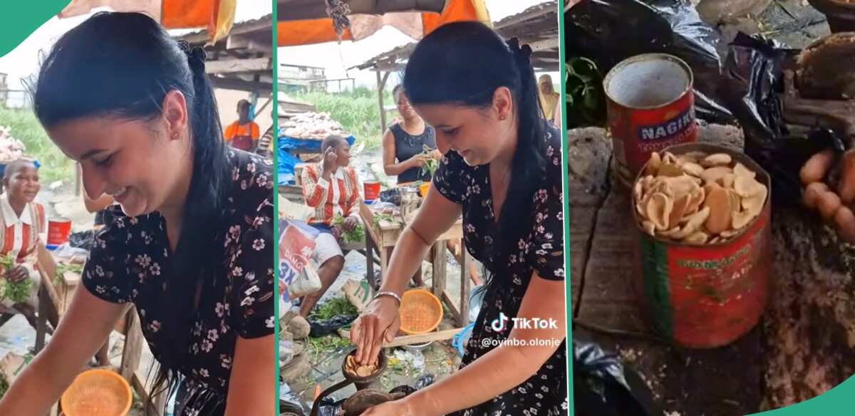 "You Tried": White Woman Spotted Grinding Ogbono Soup Inside Nigerian Market, Video Causes Buzz