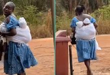 Mother straps twin babies to her back at the same time with wrapper, video stuns...