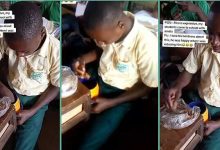 Nigerian boy caught on camera eating amala during lunch break, video stirs react...