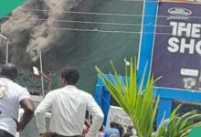 See how firefighters rescued lady as fire guts popular Lagos supermarket