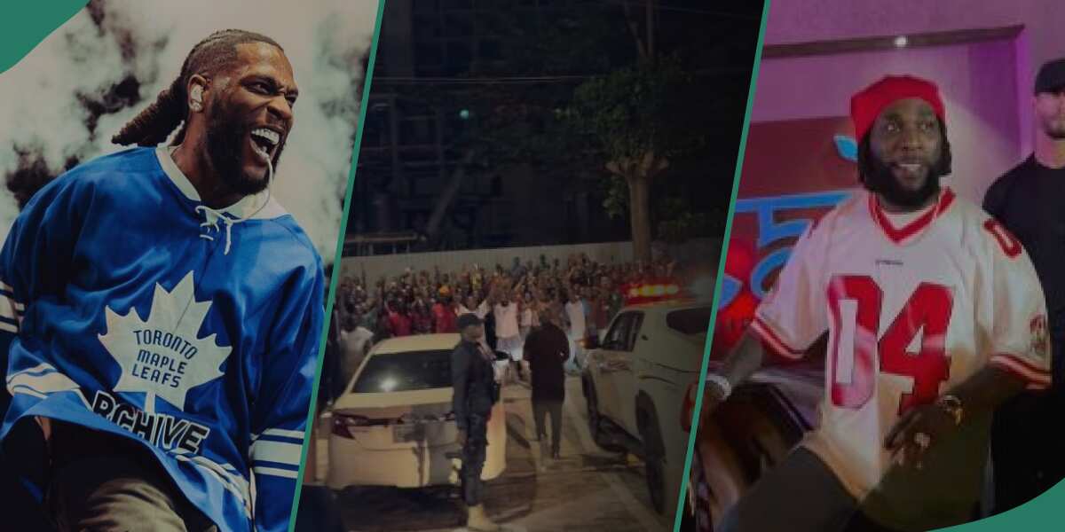“My Typical Day in Nigeria”: Crowd Gathers, Hails Burna Boy As He Steps Out of Building, He Responds