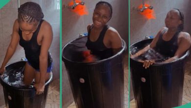 Lady Dips Herself Inside Big Drum Filled With Cold Water After She Could Not Go to Swimming Pool