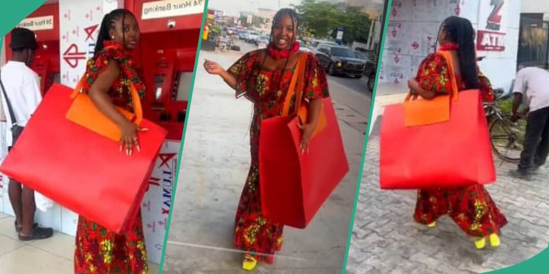 Drama as Nigerian Girl Is Captured on the Road With Gigantic Red Bag, Video Goes Viral